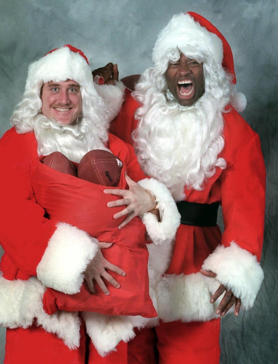 In 1996, linebackers Kevin Greene (left) and Lamar Lathon dressed up as Santa Claus for a Charlotte Observer photo. Greene and Lathon were nicknamed “Salt and Pepper.” In that season, they combined for 28 sacks, the most by a pass-rushing duo in Carolina history.