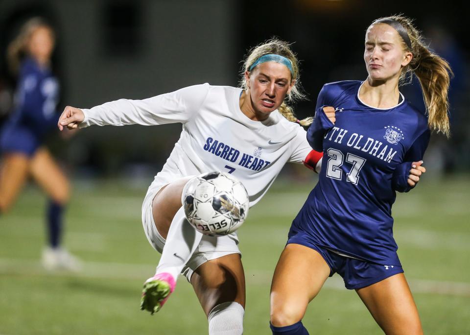 Sacred Heart's Lilly Lund battles South Oldham's Adison Welsh for control in the first half of the girls state soccer quarterfinals. The Valkyries defeated South Oldham 2-1 Monday night. Oct. 16, 2023.