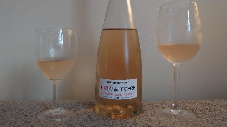 Rosé bottle with full glasses