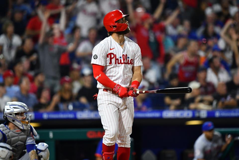 Harper watches a home run against the Mets.