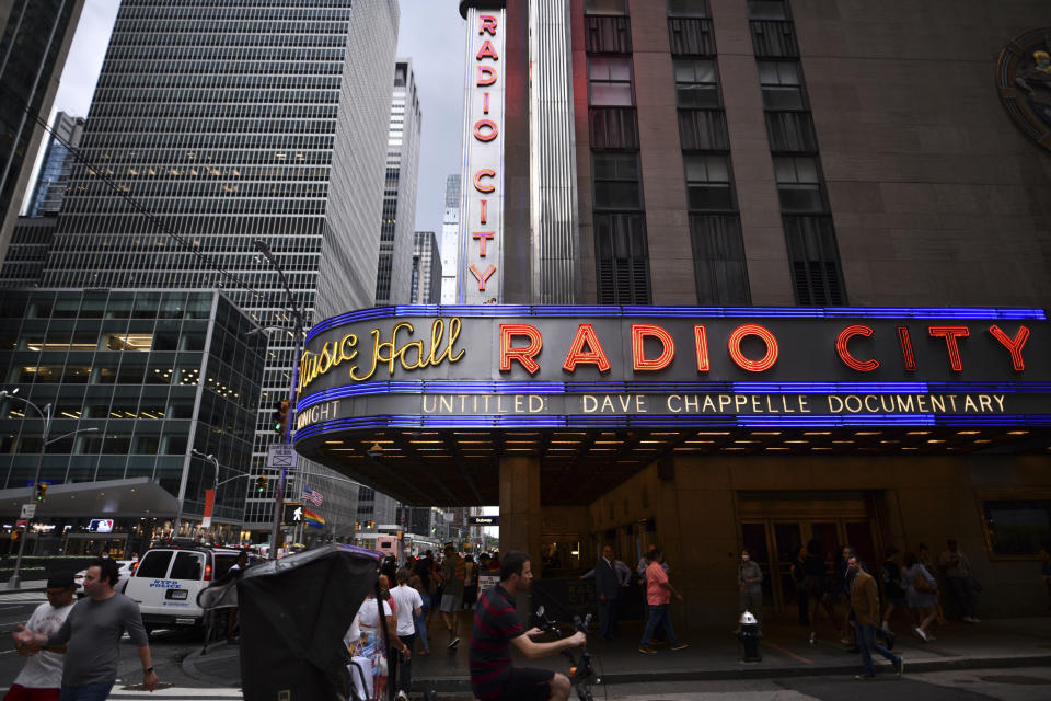 Radio City Music Hall's marquee advertises Dave Chappelle's untitled documentary during the closing night celebration for the 20th Tribeca Festival on Saturday, June 19, 2021, in New York. (Photo by Charles Sykes/Invision/AP)