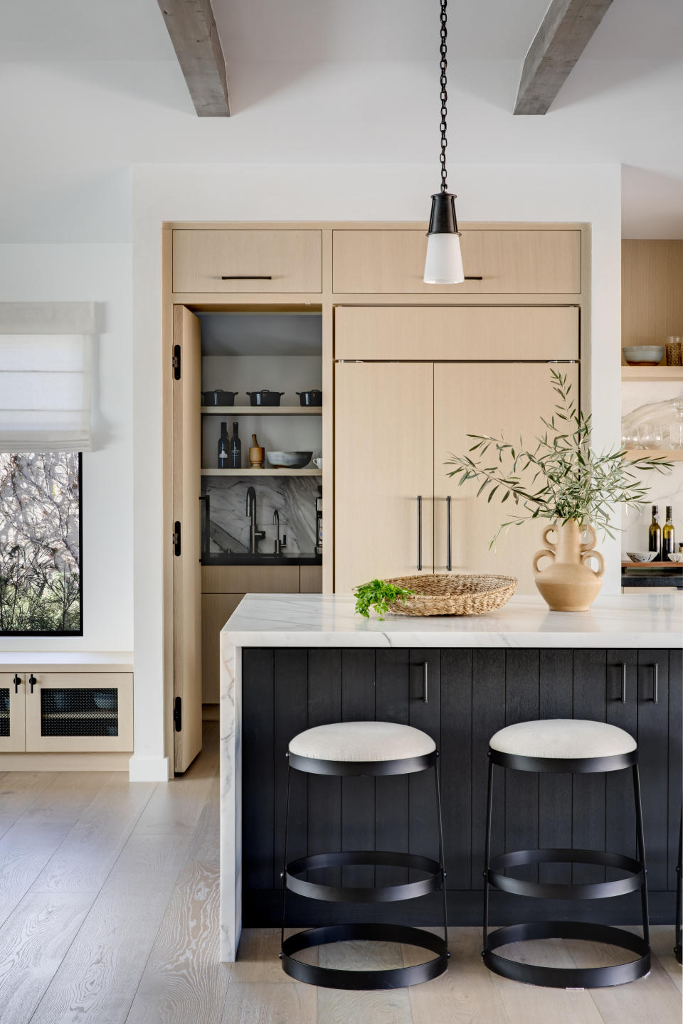 A pantry in wood inside a kitchen