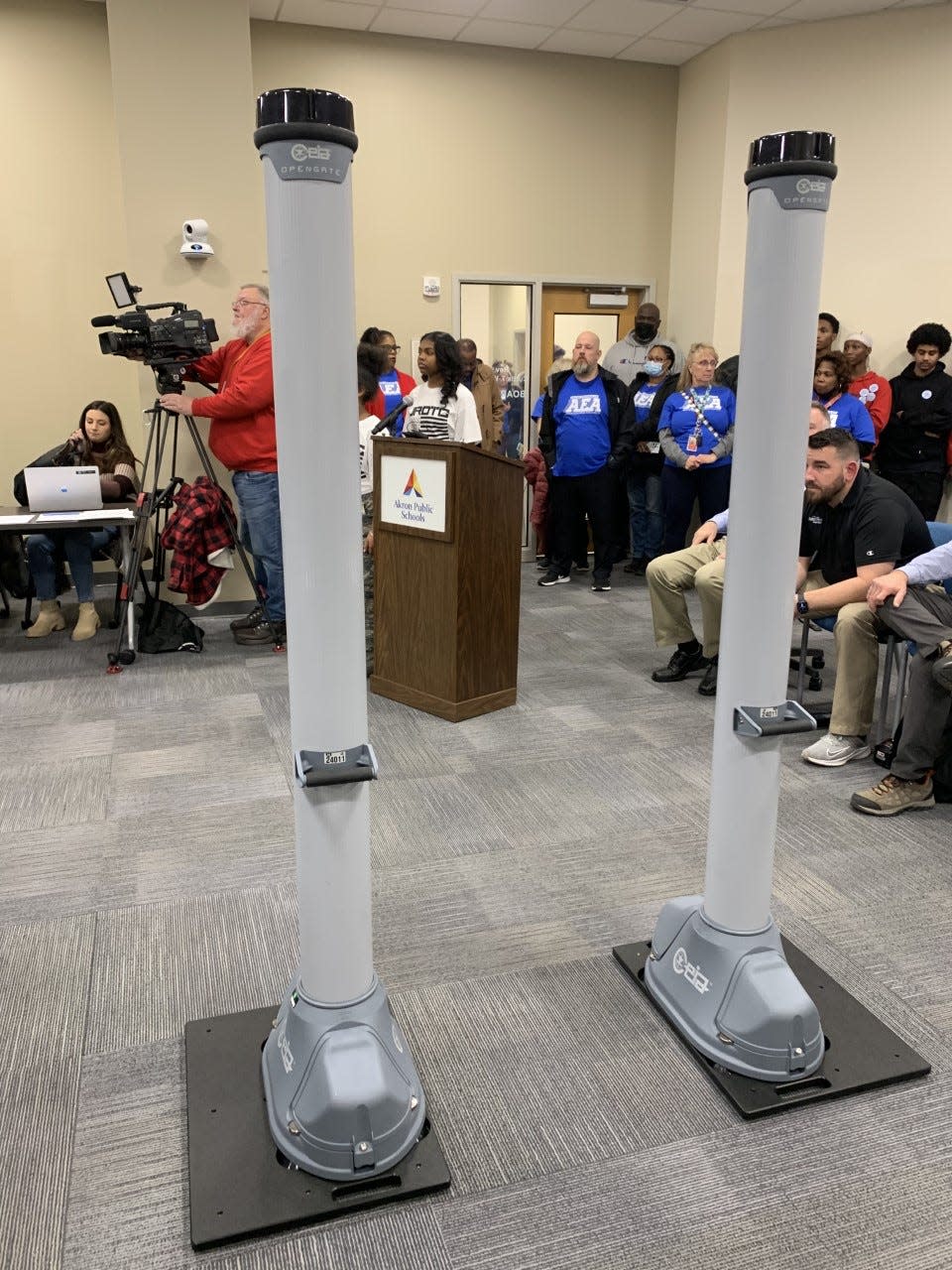 An example of the walk-through metal detectors the Akron Public Schools' administration wants to buy is on display Monday night at the school board meeting.