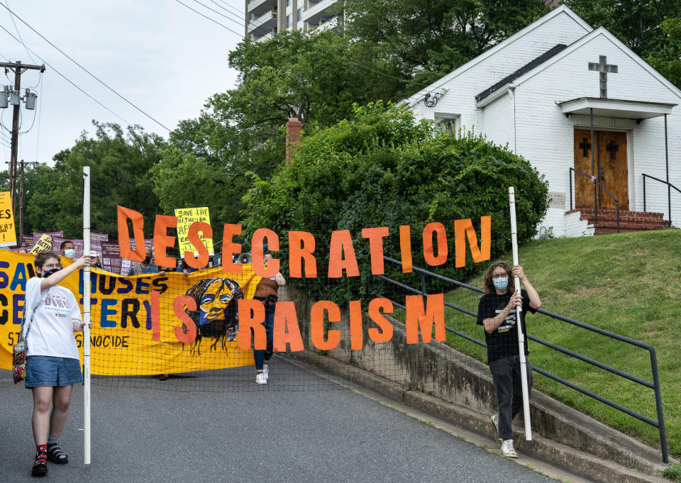 Image: Supporters of the Moses African Cemetery in Bethesda, Md., march past the Macedonia Baptist Church on Sept. 10, 2021, in protest of a planned sale of the land. (Gail Rebhan)