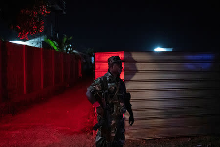 A soldier stands guard outside a training camp allegedly linked to Islamist militants, in Kattankudy near Batticaloa, Sri Lanka, May 5, 2019. REUTERS/Danish Siddiqui