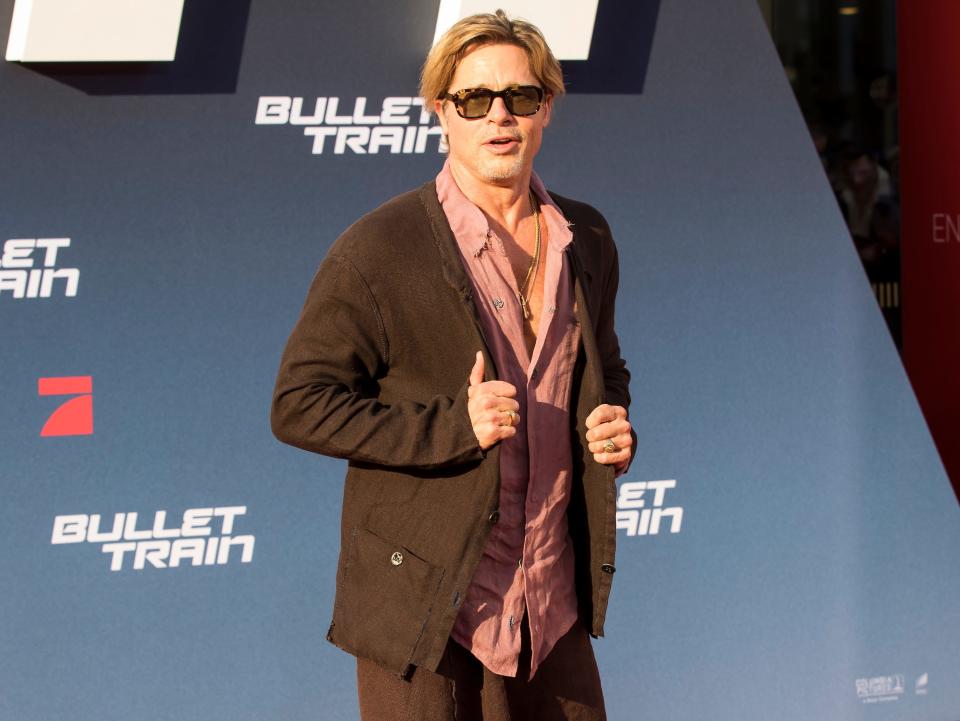 Brad Pitt in a brown skirt at the Bullet Train Premiere.