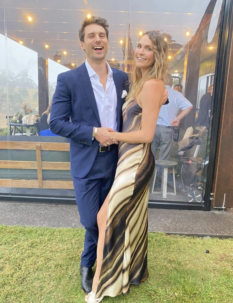 Matty J and Laura pose for a photo while attending a wedding.