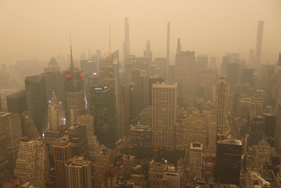 Heavy smoke shrouds buildings around Times Square in a view looking north from the Empire State Building as the sun sets on June 6, 2023, in New York City. / Credit: Gary Hershorn/Getty Images