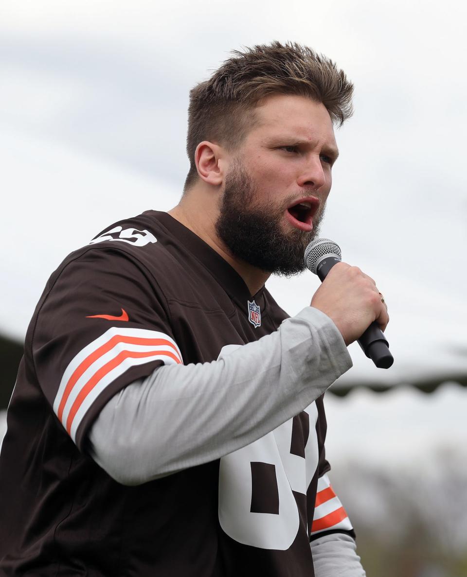 Cleveland Browns defensive end Chase Winovich gets the players fired up as he speaks during a groundbreaking ceremony for the Buchtel Griffins' new football field at John R. Buchtel CLC on Monday.