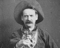 Actor George Barnes points his pistol in a scene from the 1903 silent movie, The Great Train Robbery, in this vintage image from the 11-minute movie, which premiered in December 1903. AP Photo.