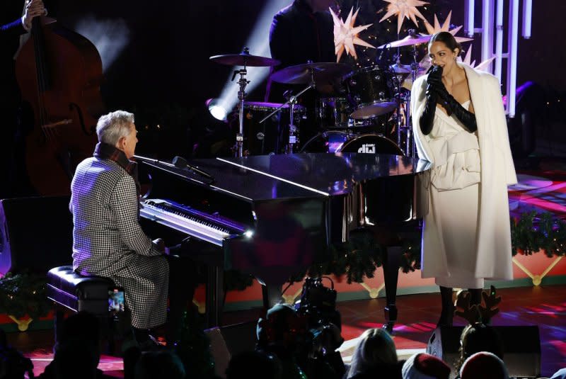 Katharine McPhee and David Foster perform at the 90th annual Rockefeller Center Christmas Tree Lighting Ceremony at Rockefeller Center in New York City in 2022. File Photo by John Angelillo/UPI