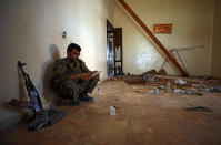 <p>A Syrian Democratic Forces (SDF) fighter uses a tablet as he sits inside a room in the al-Mishlab district at Raqqa’s southeastern outskirts, Syria June 7, 2017. Picture taken June 7, 2017. (Photo: Rodi Said/Reuters) </p>