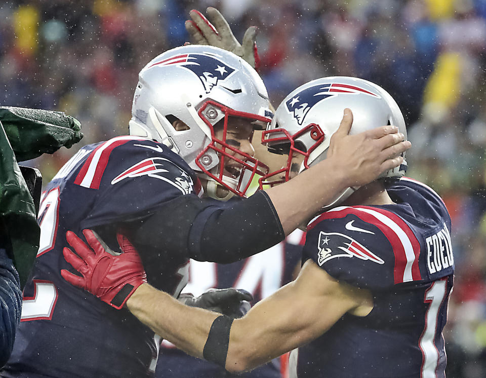 New England Patriots quarterback Tom Brady and Julian Edelman celebrated their 8-yard touchdown connection during an October game last season. (Photo: Boston Globe via Getty Images)