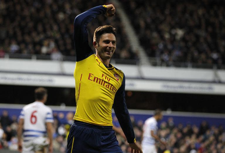 Arsenal's Olivier Giroud celebrates scoring the opening goal during their English Premier League match against Queen's Park Rangers, at Loftus Road Stadium in London, on March 4, 2015