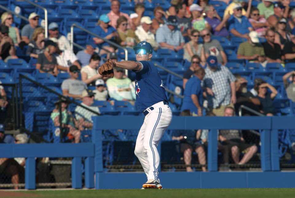 Toronto Blue Jays' Matt Chapman makes a throw to first during the team's spring training baseball game against the Detroit Tigers on Saturday, March 25, 2023, in Dunedin, Fla. (Mark Taylor/The Canadian Press via AP)