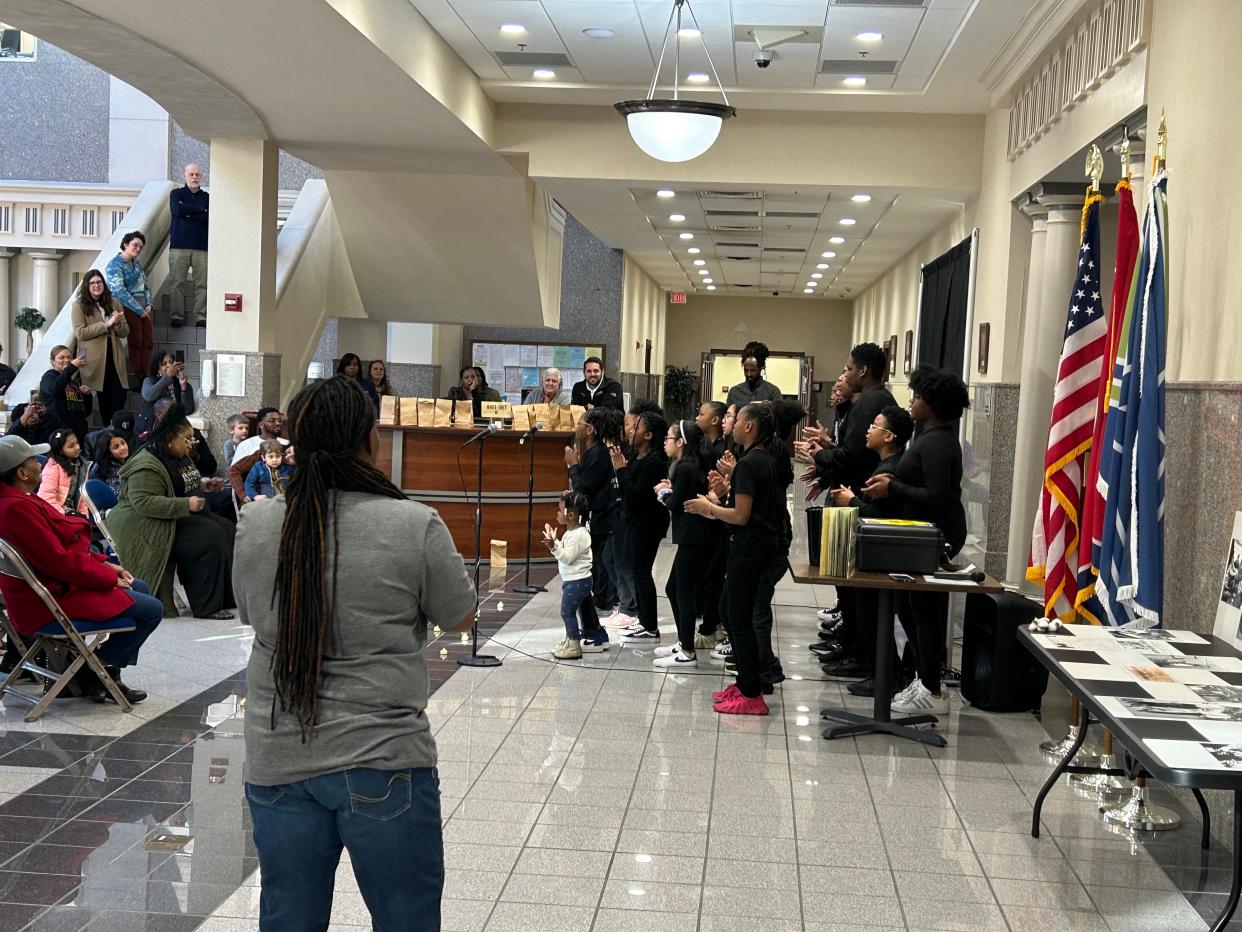 The Children's Theatre Company of Jackson "Kids with a Cause" performed 'This Little Light of Mine' on the first floor of City Hall as dance teacher Nadia Beard watches.
