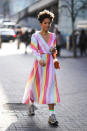 <p>One guest embraced the capital’s sun in a rainbow-hued dress with neon socks and chunky trainers. <em>[Photo: Getty]</em> </p>