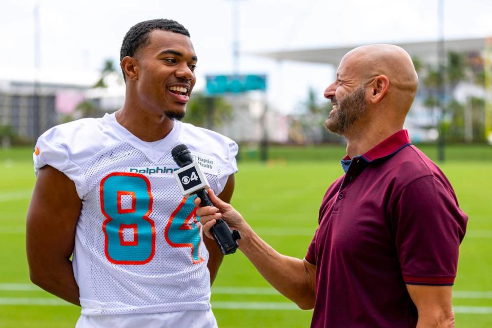 Rookie tight end Elijah Higgins (84) speaks to play-by-play commentator Steve Goldstein during 2023 Miami Dolphins Rookie Minicamp at Baptist Health Training Complex in Miami Gardens, Florida, on Friday, May 12, 2023.
