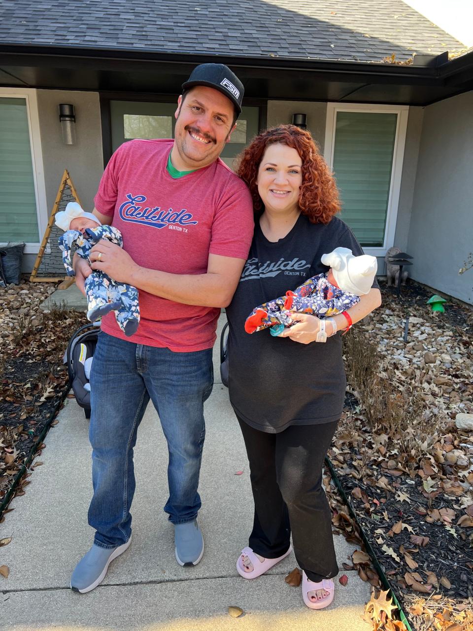 Cliff Scott, at left, and Kali Scott, at right, of Denton, Texas, at home Jan. 3, 2023 with their twins, Annie Jo, who was born on Dec. 31, 2022, and Effie Rose, who was born a few minutes later at 12:01 a.m. Jan. 1, 2023, at Texas Health Presbyterian Hospital Denton.