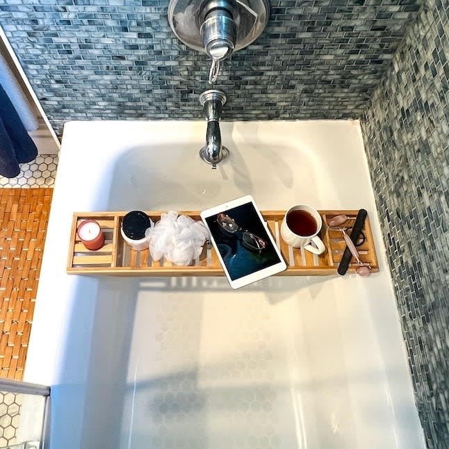 Bamboo bathtub caddy in a bathtub