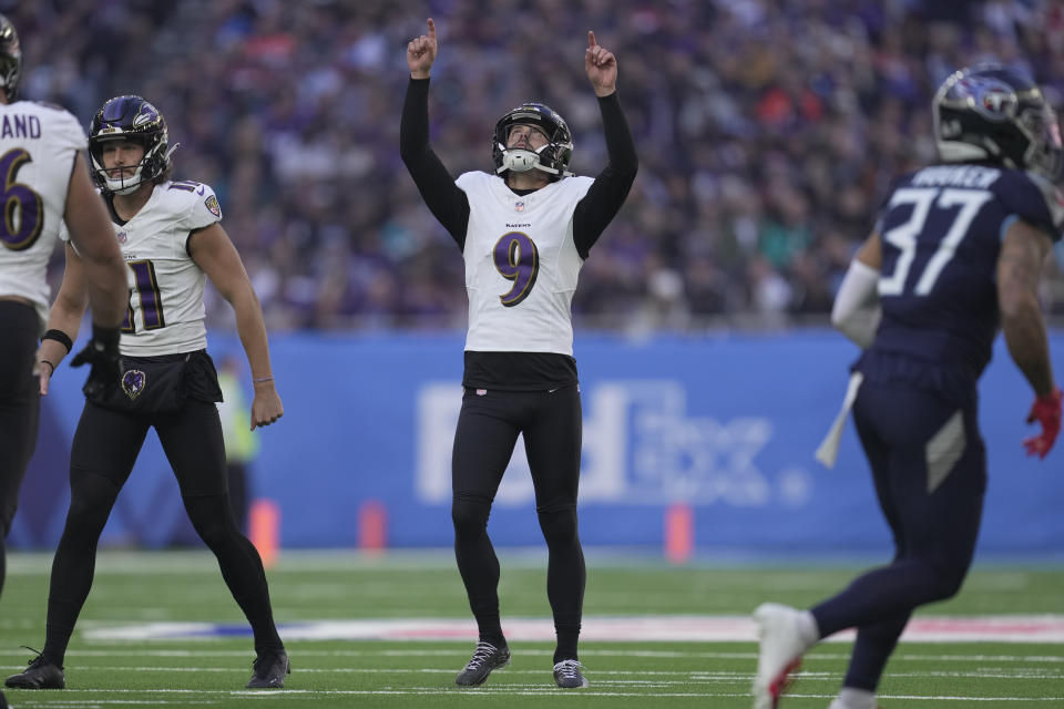 Baltimore Ravens place-kicker Justin Tucker (9) celebrates a 41-yard field goal against the Tennessee Titans during the first half of an NFL football game Sunday, Oct. 15, 2023, at the Tottenham Hotspur stadium in London. (AP Photo/Kin Cheung)