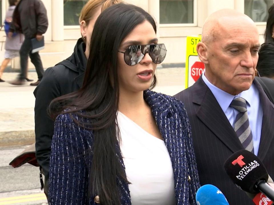 Emma Coronel, center, wife of notorious Mexican drug lord Joaquin "El Chapo" Guzman, is flanked by his defense lawyers, Eduardo Balarezo, left, and William Purpura, as she speaks with reporters. AP Photo:Ted Shaffrey