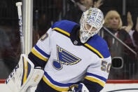 St. Louis Blues goaltender Jordan Binnington reacts after giving up a goal to New Jersey Devils defenseman Dakota Mermis during the second period of an NHL hockey game, Friday, March 6, 2020, in Newark. (AP Photo/John Minchillo)