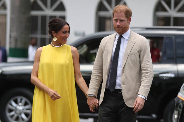 <p>KOLA SULAIMON/AFP via Getty</p> Meghan Markle and Prince Harry at the at the State Governor House in Lagos, Nigeria on May 12, 2024.