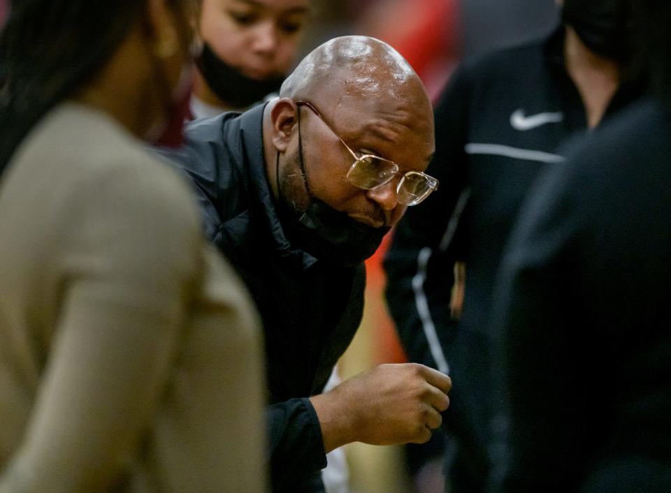 Peoria High head coach Demetrius Edwards talks with his players before the start of their game against Morton on Saturday, Jan.15, 2022 at Peoria High School. The Lions defeated the Potters 41-32.