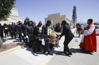FILE - In this June 30, 2020, file photo, pallbearers carry Robert Fuller's casket after his funeral in Littlerock, Calif. A police investigation confirmed suicide was the cause of death of Fuller, a Black man found hanging from a tree in a Southern California city park last month, authorities said Thursday, July 9, 2020. (AP Photo/Marcio Jose Sanchez, File)