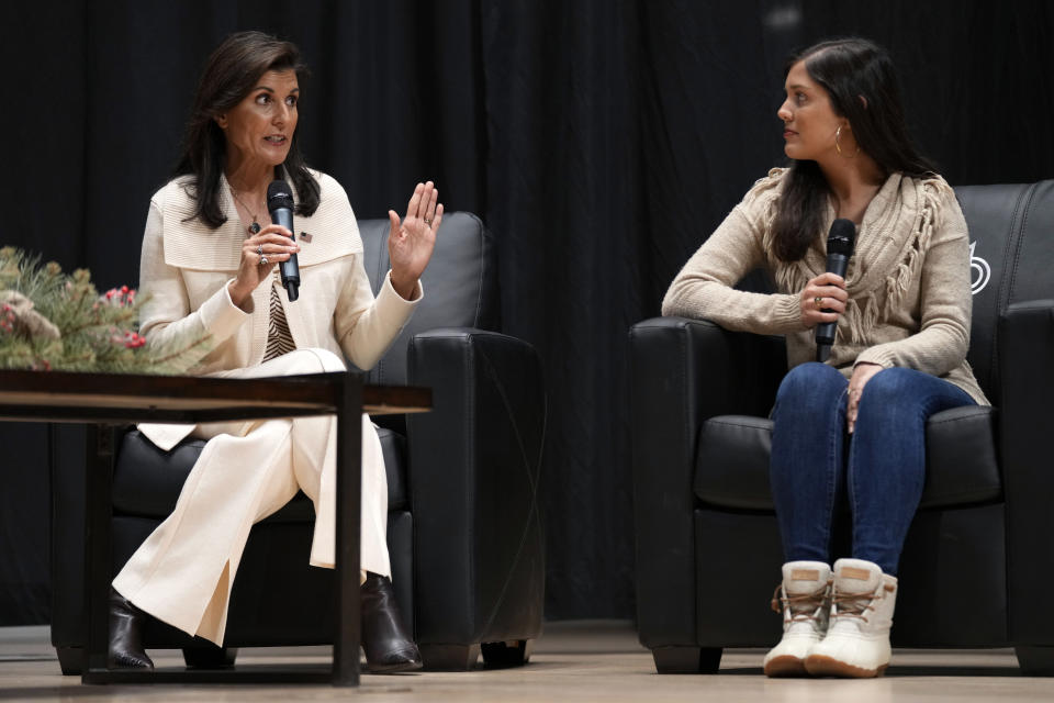 Republican presidential candidate former United Nations Ambassador Nikki Haley, left, speaks as her daughter Rena, right, looks on during U.S. Rep. Randy Feenstra's, R-Iowa, Faith and Family with the Feenstras event, Saturday, Dec. 9, 2023, in Sioux Center, Iowa. (AP Photo/Charlie Neibergall)