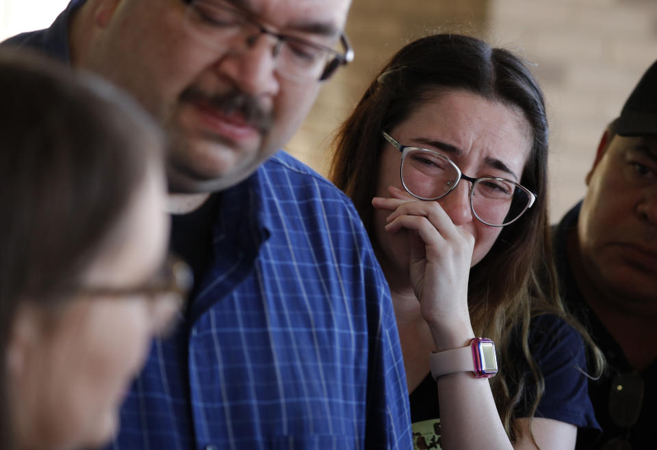 FILE - Leta Jamrowski wipes away tears as her parents Misti Jamrowski left, and Paul Jamrowski speak with the media at University Medical Center of El Paso, Sunday, Aug. 4, 2019, in El Paso, Texas. Leta's sister was killed in the mass shooting at a El Paso shopping complex. The shooting at a supermarket in Buffalo, New York, on Saturday, May 14, 2022, is the latest example of something that's been part of U.S. history since the beginning: targeted racial violence. (AP Photo/John Locher, File)