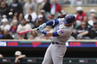 CORRECTS DATE TO MAY 14 INSTEAD OF MAY 15 - Chicago Cubs' Ian Happ hits a fly ball to Minnesota Twins center fielder Nick Gordon for an out during the first inning of a baseball game Sunday, May 14, 2023, in Minneapolis. (AP Photo/Stacy Bengs)