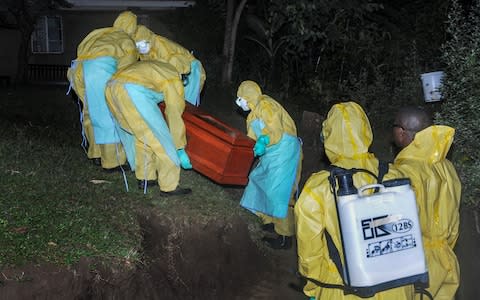 The funeral today of Agnes Mbambu, grandmother of the 5-year-old boy who became Ebola's first cross-border victim in Uganda  - Credit: &nbsp;Ronald Kabuubi/AP