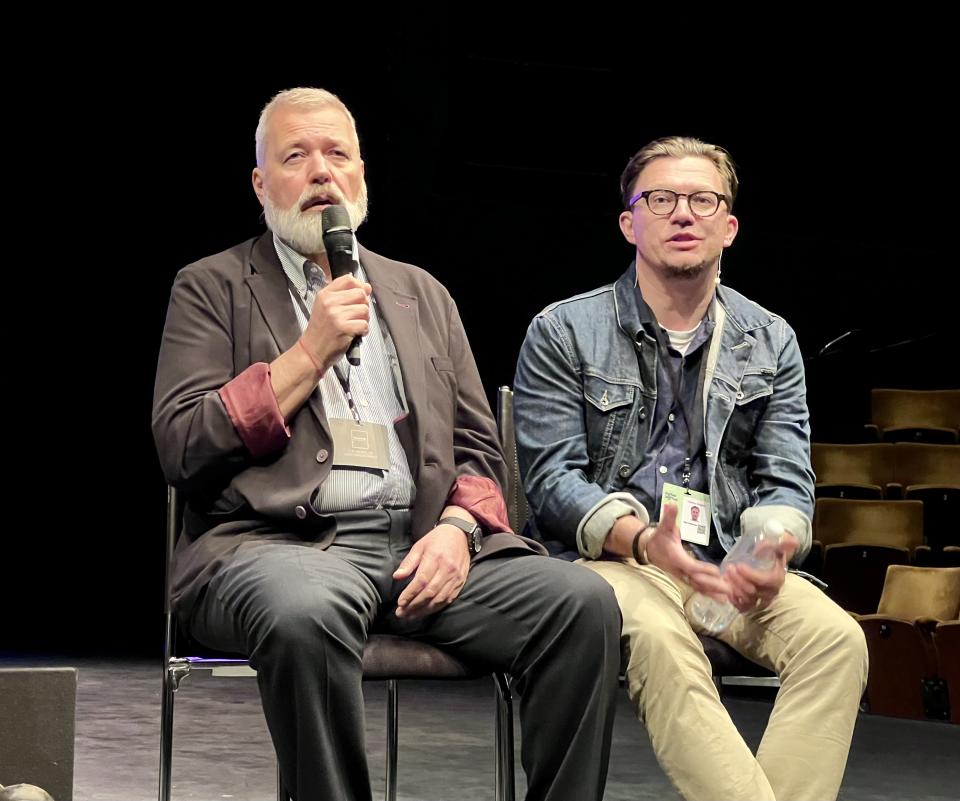 Dmitry Muratov (L) and interpreter