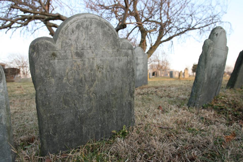 The gravestone of Cuffe Gibbs, a slave buried in  God's Little Acre, at the Common Burial Grounds, Newport. His brother, Pompi Stevens, who worked as a stonecarver at the John Stevens Shop, carved his gravestone. Cuffe Gibbs died in 1768. The Providence Journal files/Frieda Squires