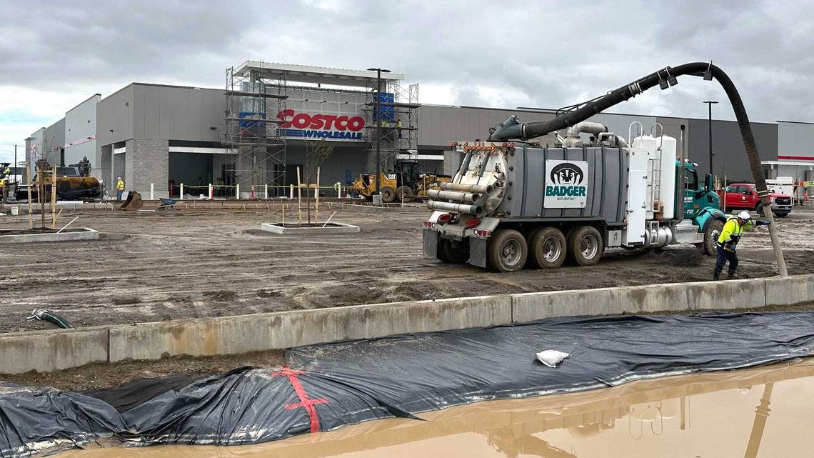 A construction worker pours concrete for the parking lot of the soon-to-open Costco location near Arena Boulevard in the Natomas Crossing section of Sacramento on Thursday, Feb. 8, 2024. A city councilwoman said the big-box membership retailer’s newest capital region location will open March 14. Daniel Hunt/dhunt@sacbee.com