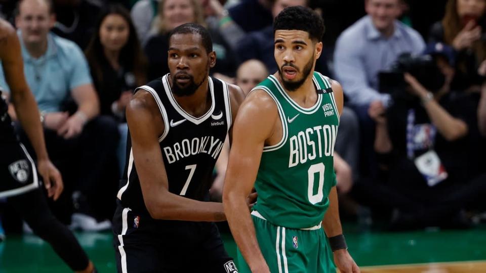 Kevin Durant standing with Jayson Tatum Game 2