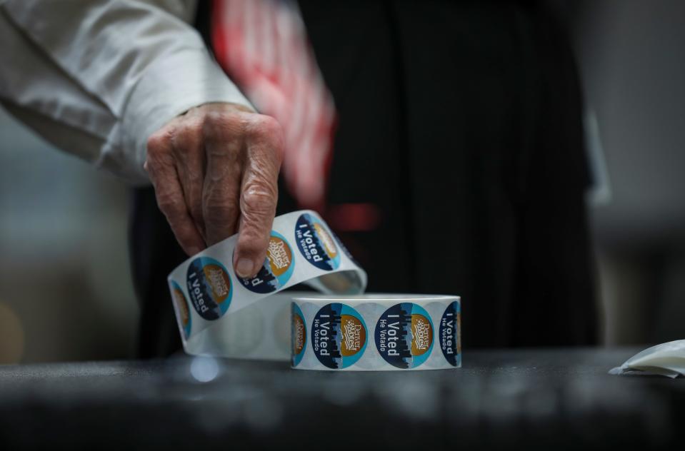 DENVER, CO - JUNE 28: An election judge rolls up "I Voted" stickers during voting in the State Primaries on June 28, 2022 at the Wellington E. Webb Municipal Office Building in Denver, Colorado. Many people running for office in the state support former President Donald Trump and his view of the 2020 election. (Photo by Marc Piscotty/Getty Images) ORG XMIT: 775832100 ORIG FILE ID: 1241597177