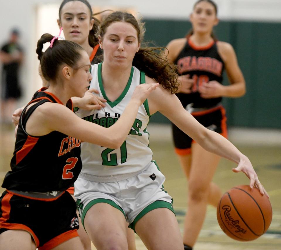 West Branch's Sophia Gregory charges past Chagrin Fall's Abby Kay in the first half of OHSAA Division II District Semifinals at Nordonia High School. Wednesday, February 28, 2024.