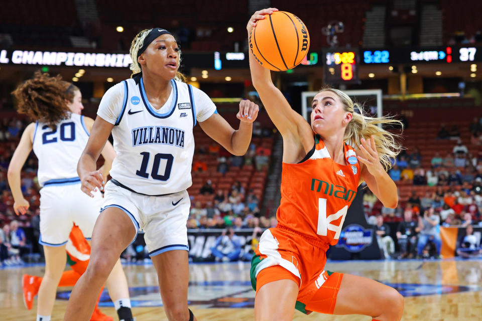Miami's Haley Cavinder drives to the basket against Villanova's Christina Dalce during the second half in the Sweet 16 round of the NCAA women's tournament at Bon Secours Wellness Arena in Greenville, South Carolina, on March 24, 2023. (Kevin C. Cox/Getty Images)