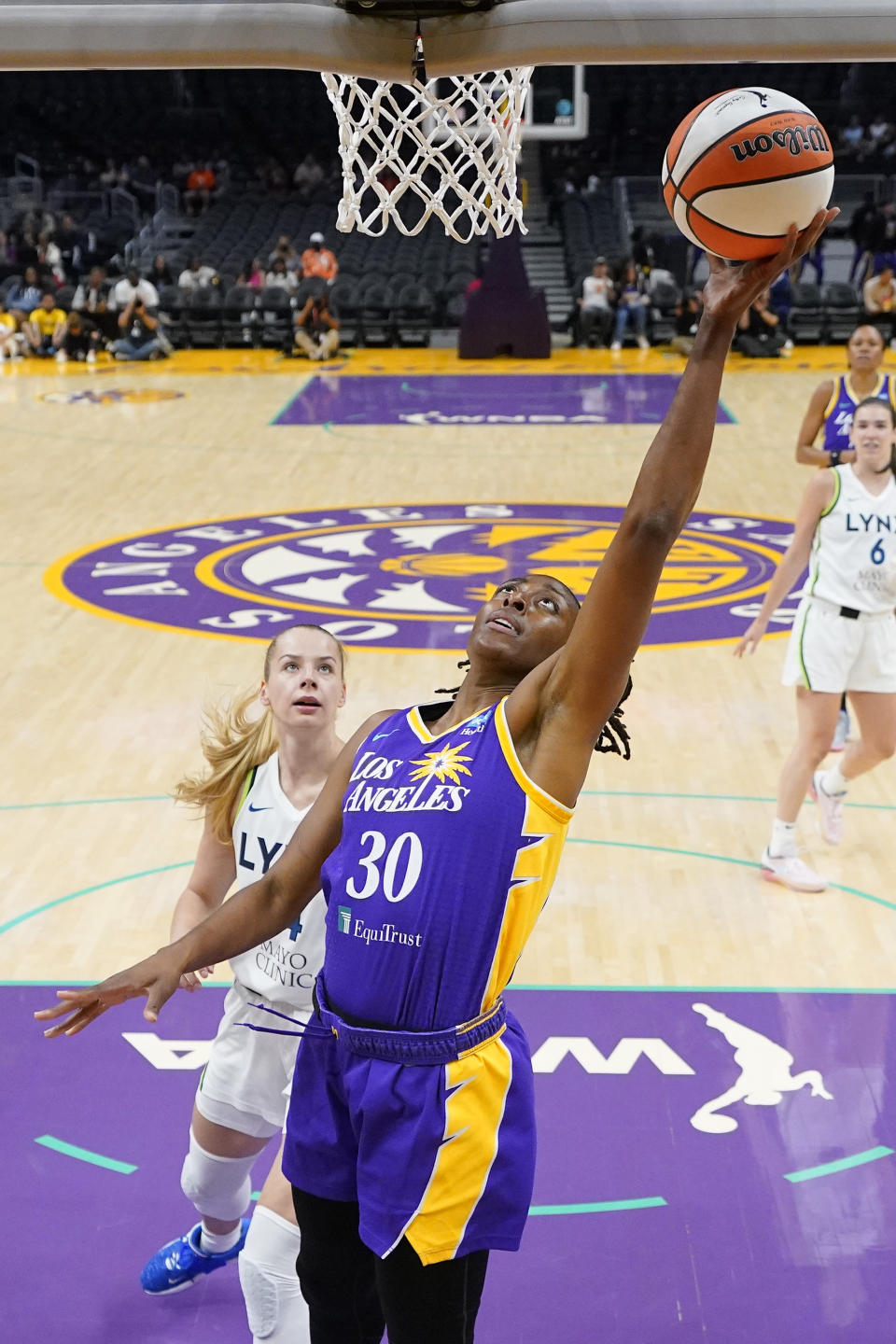 Los Angeles Sparks forward Nneka Ogwumike, right, shoots as Minnesota Lynx forward Dorka Juhasz defends during the first half of a WNBA basketball game Tuesday, June 20, 2023, in Los Angeles. (AP Photo/Mark J. Terrill)