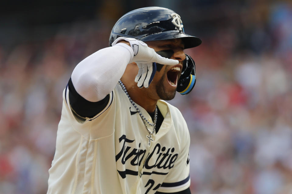 Minnesota Twins' Royce Lewis celebrates his two-run home run as he arrives at home plate during the first inning in Game 1 of an AL wild-card baseball playoff series against the Toronto Blue Jays Tuesday, Oct. 3, 2023, in Minneapolis. (AP Photo/Bruce Kluckhohn)