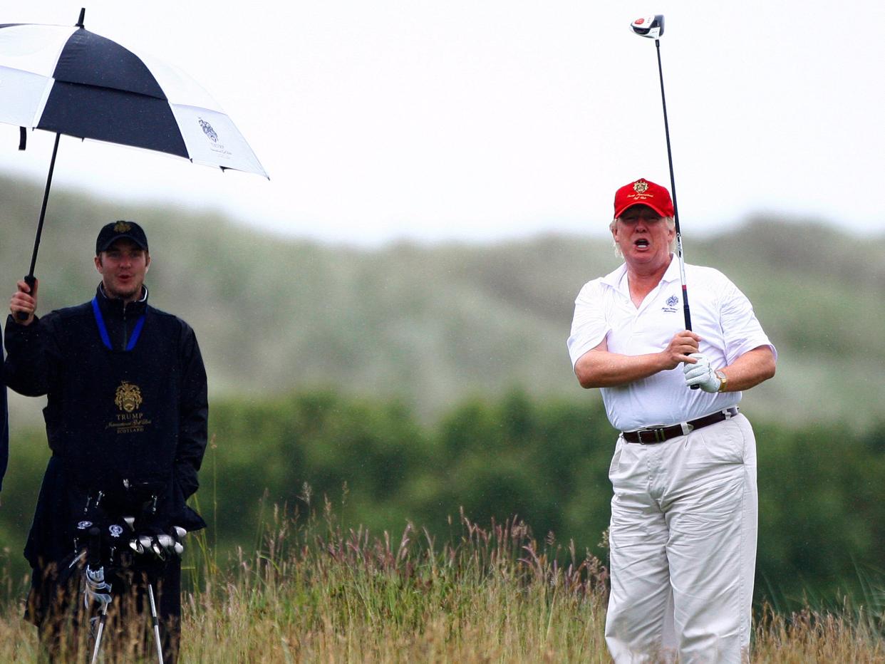 donald trump playing golf