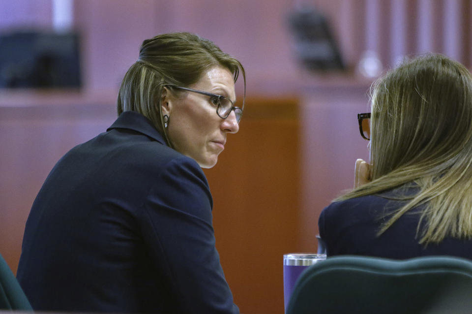 Deputy prosecuting attorney, Katelyn Farley confers with a colleague during a break in testimony on the second day of the rape trial of former Idaho state Rep. Aaron von Ehlinger at the Ada County Courthouse, Wednesday, April 27, 2022, in Boise, Idaho. (Brian Myrick/The Idaho Press-Tribune via AP, Pool)