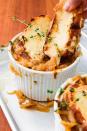 <p>We like ladling the soups into ramekins, topping each serving with bread, and melting the cheese right on top of the soup, under the grill. The top gets super crispy and bubbly, and the bottom softens slightly, making it easy to dig into. </p><p>Get the <a href="https://www.delish.com/uk/cooking/recipes/a31012320/easy-french-onion-soup-recipe/" rel="nofollow noopener" target="_blank" data-ylk="slk:French Onion Soup;elm:context_link;itc:0" class="link ">French Onion Soup</a> recipe.</p>