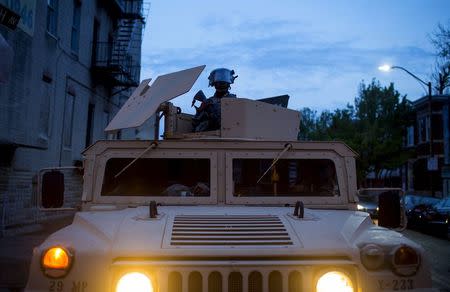 National Guard troops are seen at North Ave and Pennsylvania Ave in Baltimore, Maryland April 30, 2015. REUTERS/Eric Thayer