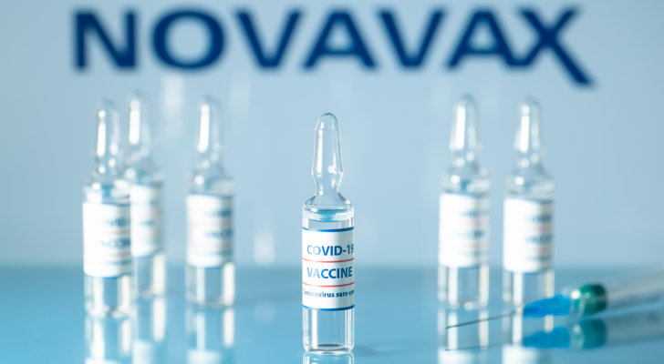 Concept of vaccine against COVID-19. Glass medical vials with liquid. Ampoules with coronavirus vaccine on a medical glass table