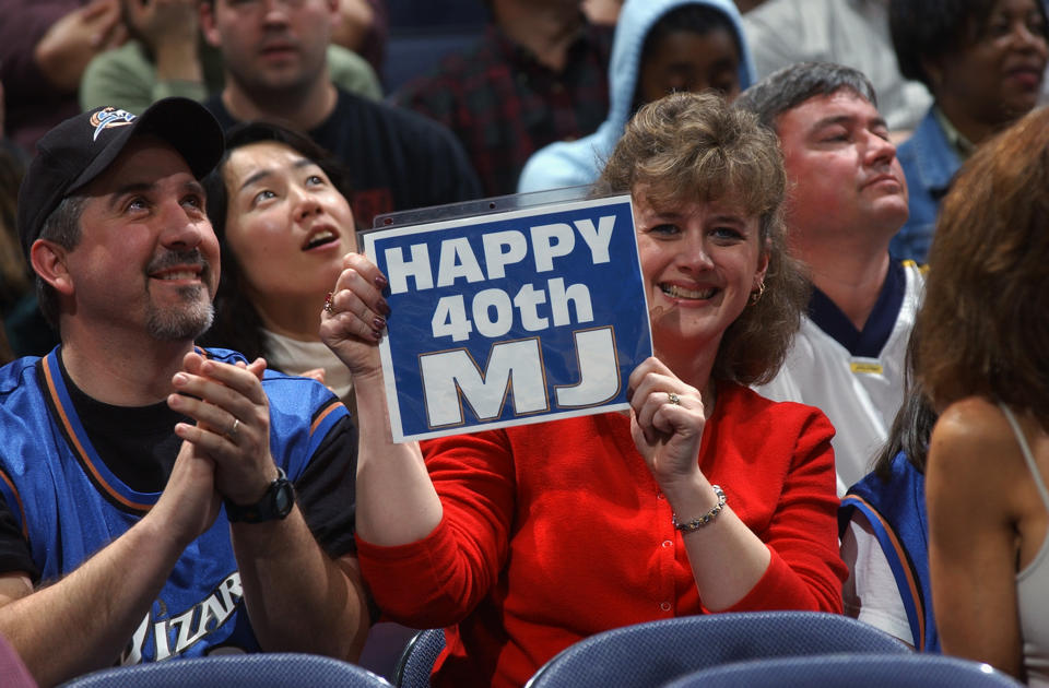 Fan wishes a happy 40th birthday to Michael Jordan #23 of the Wizards during the NBA game between the New Jersey Nets and the Washington Wizards at MCI Center on February 21, 2003 in Washington, D.C.  The Wizards won 89-86.  (Photo by Doug Pensinger/Getty Images) 