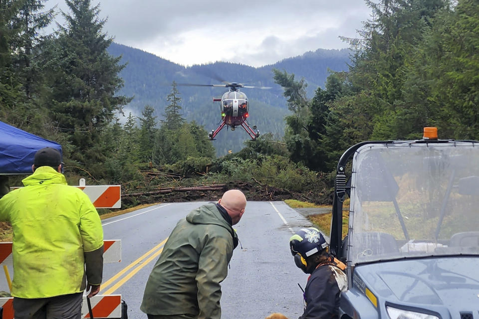 FILE - This photo provided by Division of Homeland Security and Emergency Management shows a helicopter arriving near mile 11 of the Zimovia Highway where ground teams, including search and rescue dogs, are actively working to search areas that state geologists have determined safe for entry Wednesday, Nov. 22, 2023, in Wrangell, Alaska, following a massive landslide earlier in the week. (Willis Walunga/Division of Homeland Security and Emergency Management via AP, File)